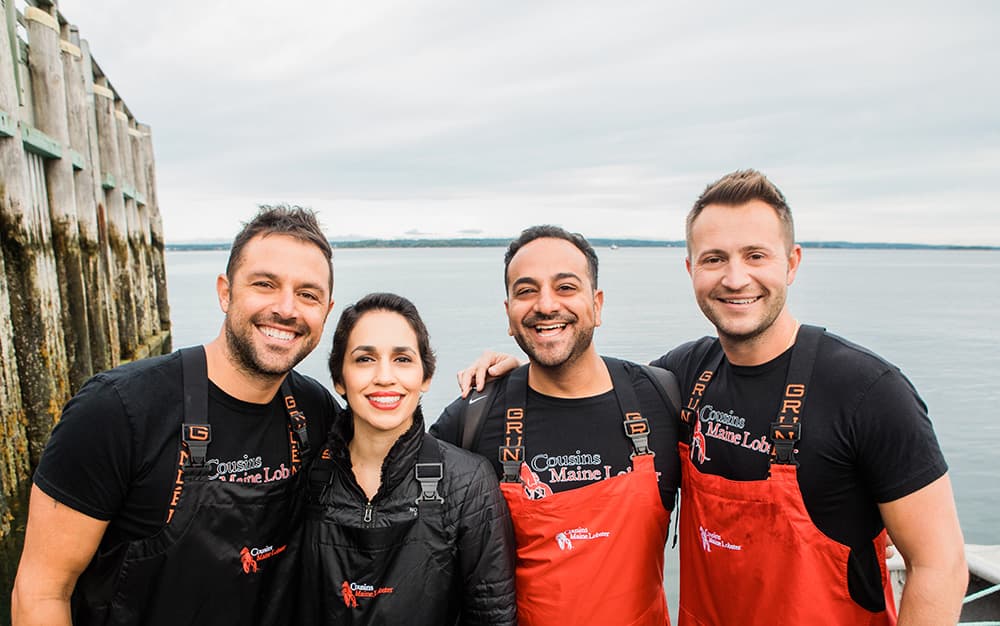 Cousins Maine Lobster franchisees stand with Jim and Sabin, the founders of Cousins Maine Lobster.