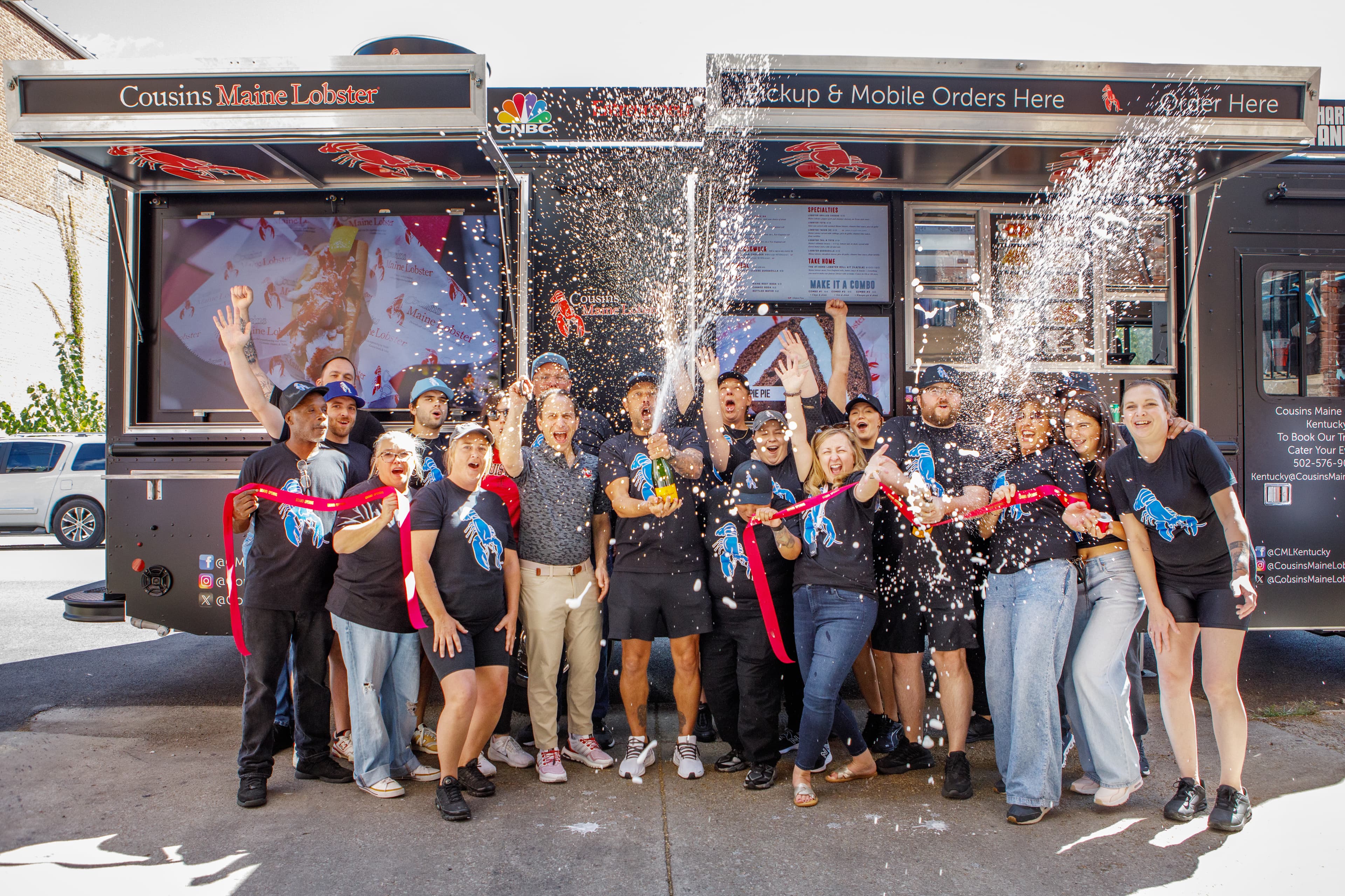 Champagne is sprayed as our Kentucky Family celebrates the trucks grand opening