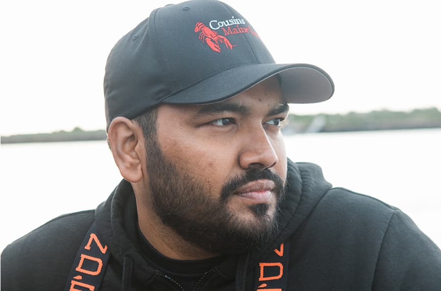 A closeup photo of the owner of Cousins Maine Lobster New York City, on a fishing boat in Maine.