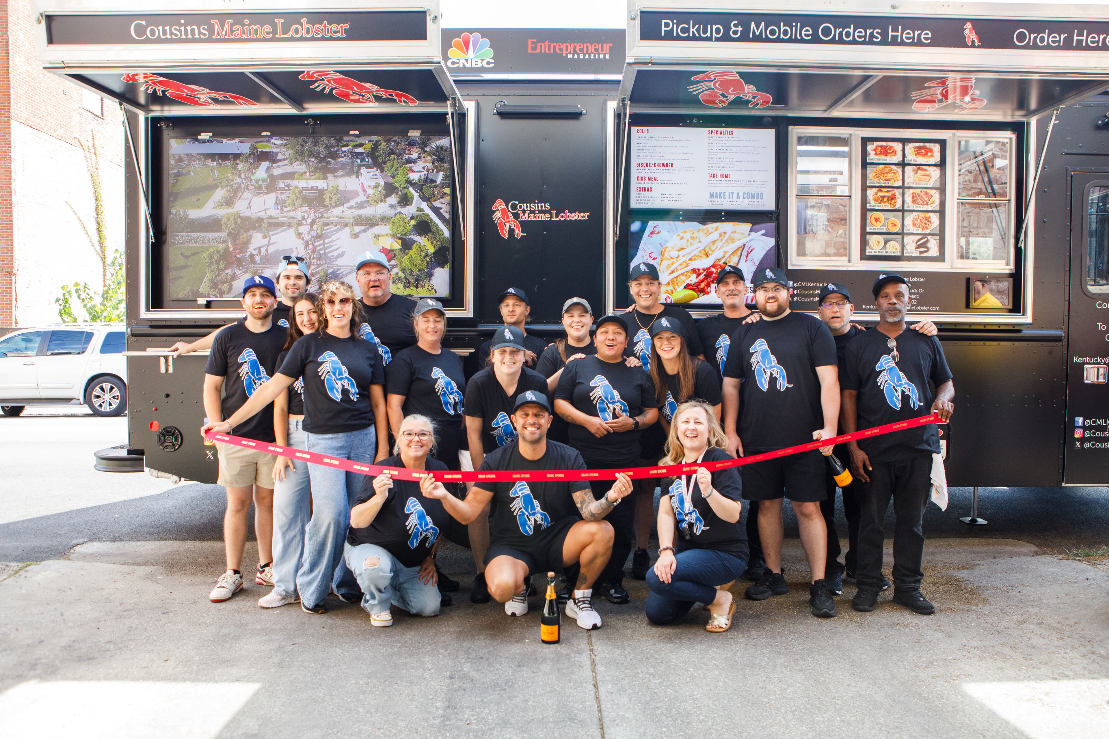 Our Kentucky Family poses in front of their truck at their Grand Opening!