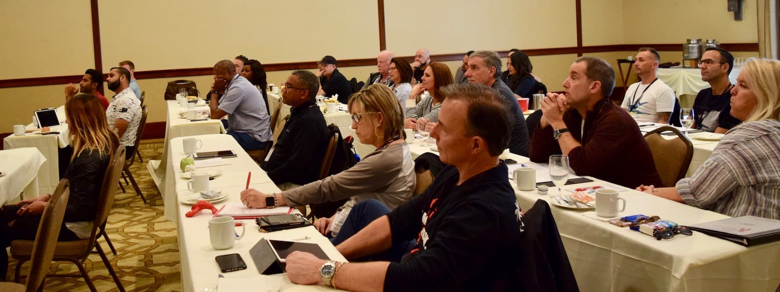 A classroom style photo of Cousins Maine Lobster franchisees learning at a Cousins Maine Lobster franchisee retreat.